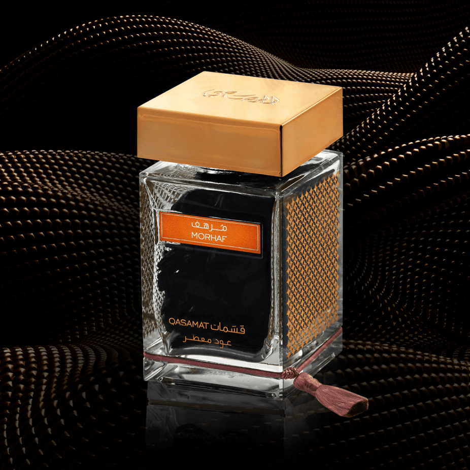 Rasasi Qasamat Morhaf Oud Moattar Bakhoor 50g with traditional incense pieces in a decorative container.