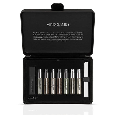 Mind Games Olfactive Amber 7-piece discovery set with seven 7.5ml perfume samples in a sleek collection.