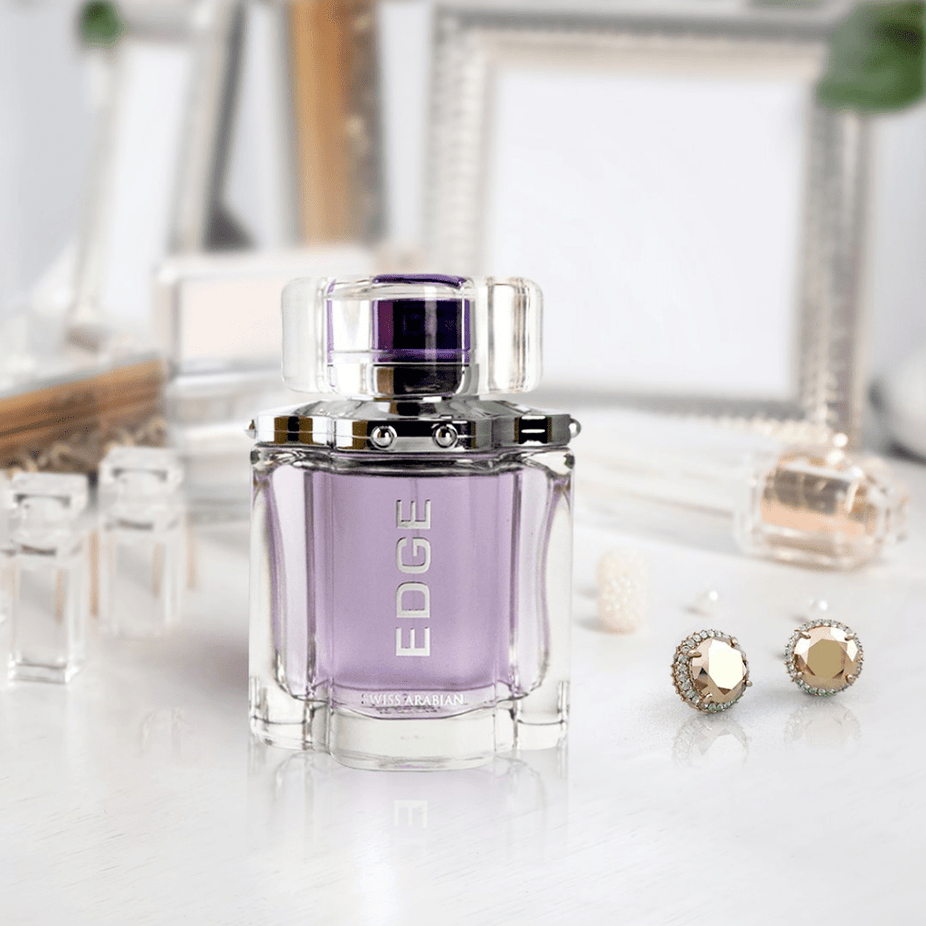Swiss Arabian Edge couple perfume set with two 100ml bottles, featuring sleek packaging for men and women in the bundle.