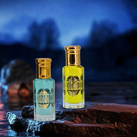 Bundle of Crys Water Men and Women perfume oils by Intense Oud in 12ml bottles with black gift box, featuring elegant packaging and branding.