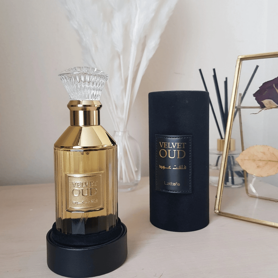 Velvet Oud EDP by Lattafa, 100ml Eau De Parfum bottle with elegant design and luxurious dark amber liquid.