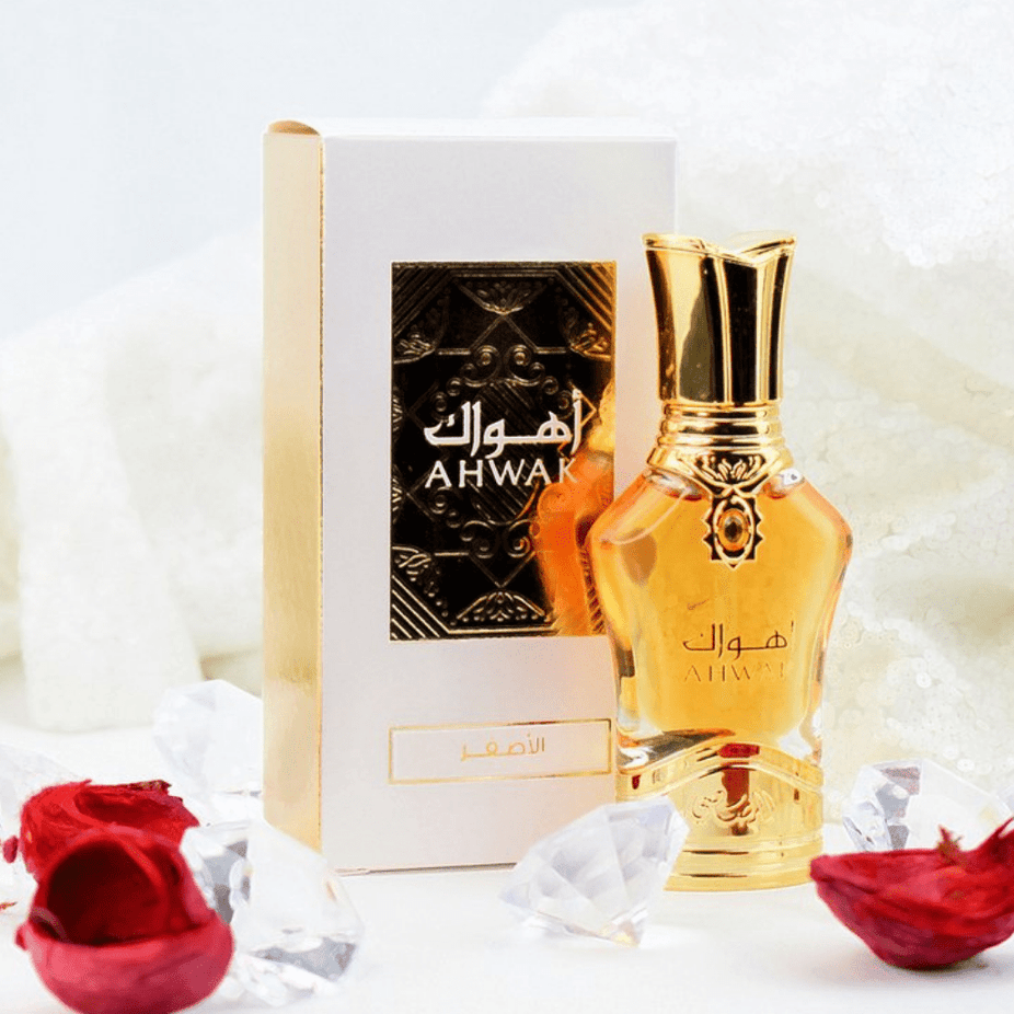 Rasasi Ahwak Al Asfar Perfume Oil 15ml bottle, concentrated perfume oil with a sleek design and elegant packaging.