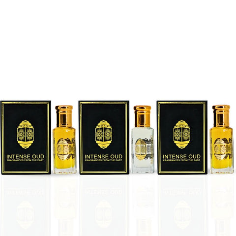 Bundle of Intense Oud Fawaken crushed and noble fruits perfume oils in 12ml bottles with a black gift box, featuring vibrant fruit illustrations.