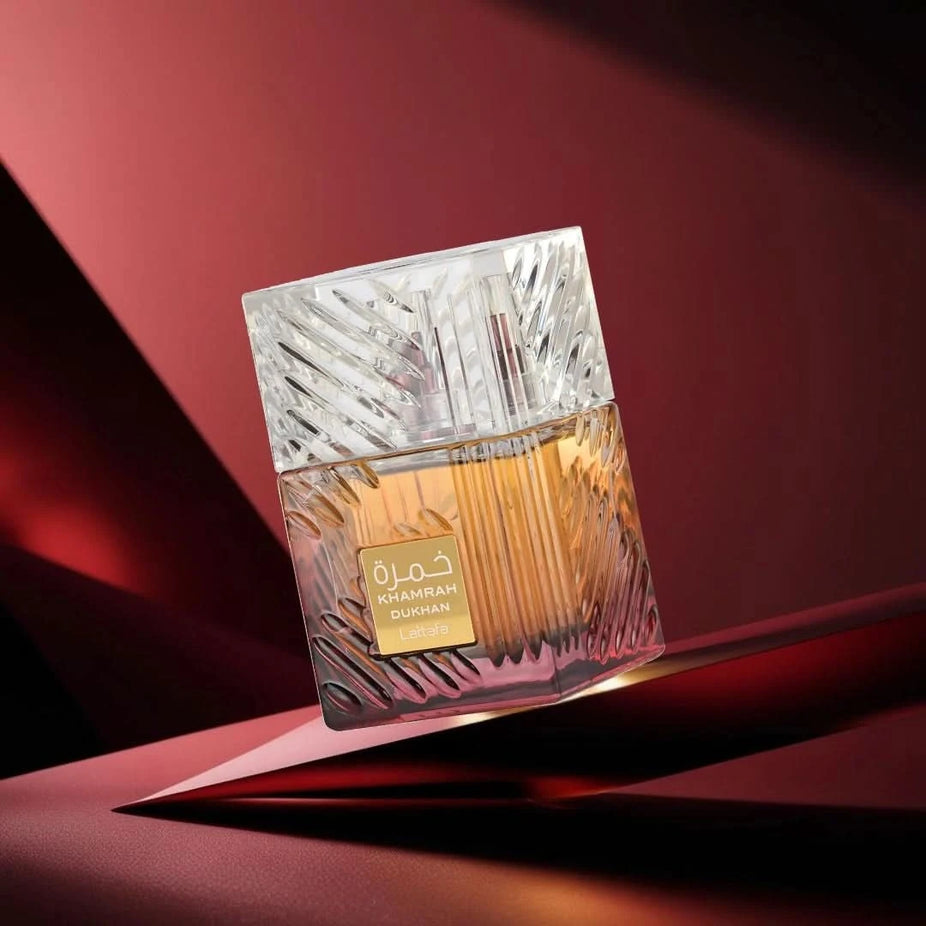 Lattafa Khamrah Dukhan and Naif Eau de Parfum sprays in 100ml bundle, featuring elegant bottles and distinct fragrance designs.
