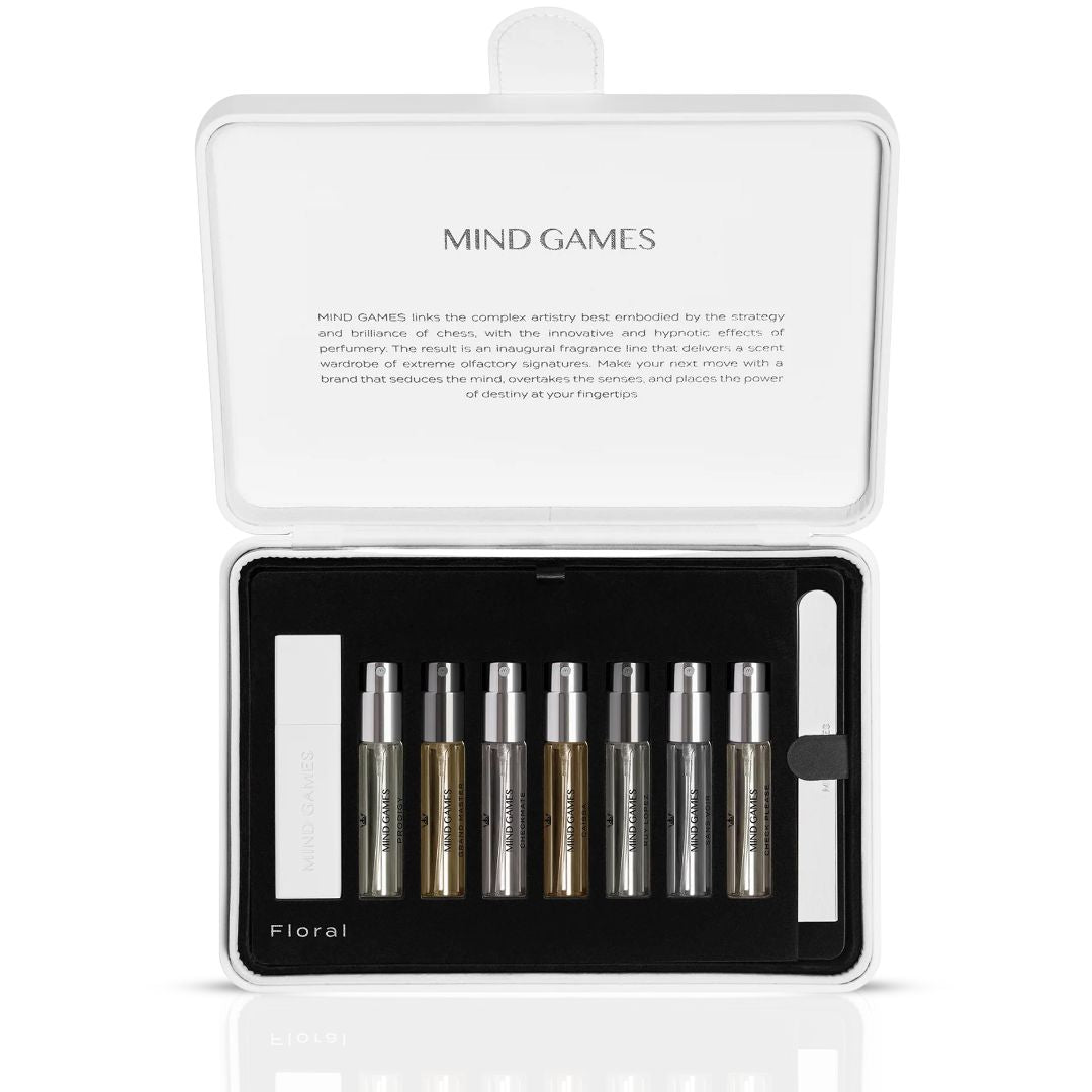 Mind Games Olfactive Floral 7-piece discovery set with seven 7.5ml fragrance vials, showcasing colorful bottles and elegant packaging.