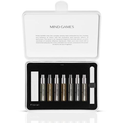 Mind Games Olfactive Floral 7-piece discovery set with seven 7.5ml fragrance vials, showcasing colorful bottles and elegant packaging.