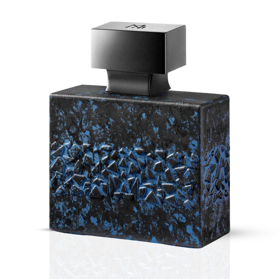 DésirToxic M. Micallef Eau De Parfum spray 100ml bottle with elegant design and floral notes on a white background.