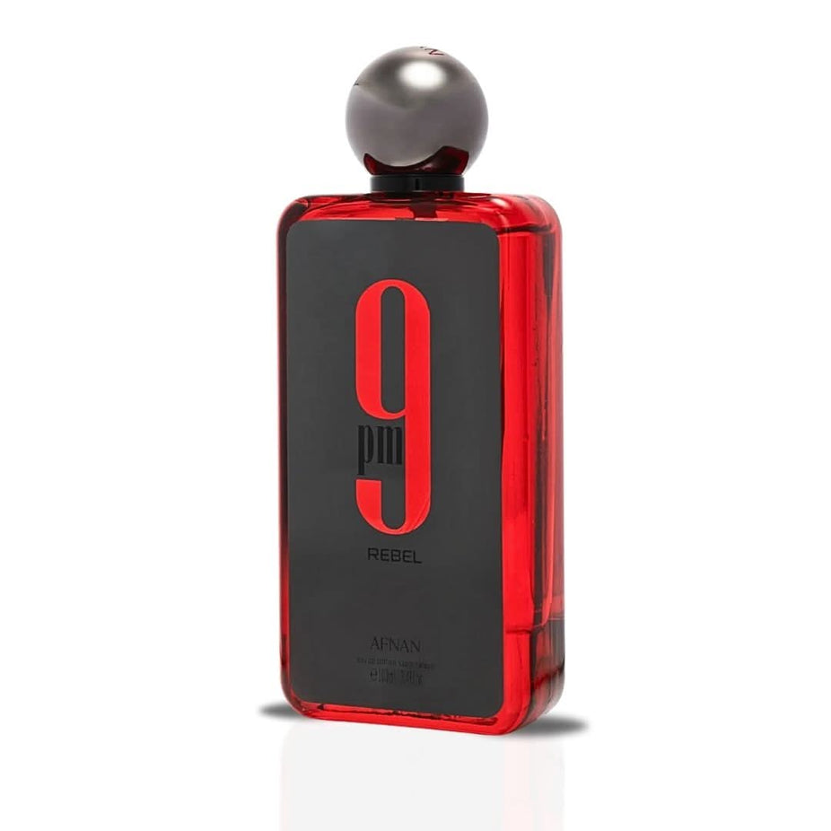 Afnan 9PM Rebel Eau de Parfum spray bottle, 100ml, with sleek black packaging and floral and woody fragrance elements.