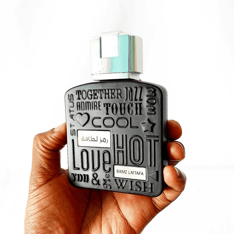 Ramz Lattafa Silver Eau de Parfum spray 100ml bottle, sleek design, showcasing the Lattafa brand and elegant packaging.