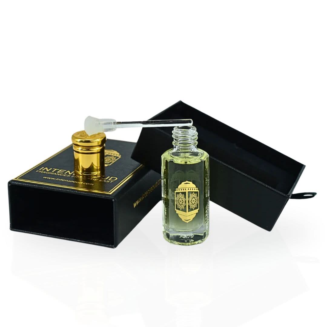 Intense Oud Emperor Perfume Oil 12ml in a black gift box, featuring a sleek, transparent glass bottle with a black cap.