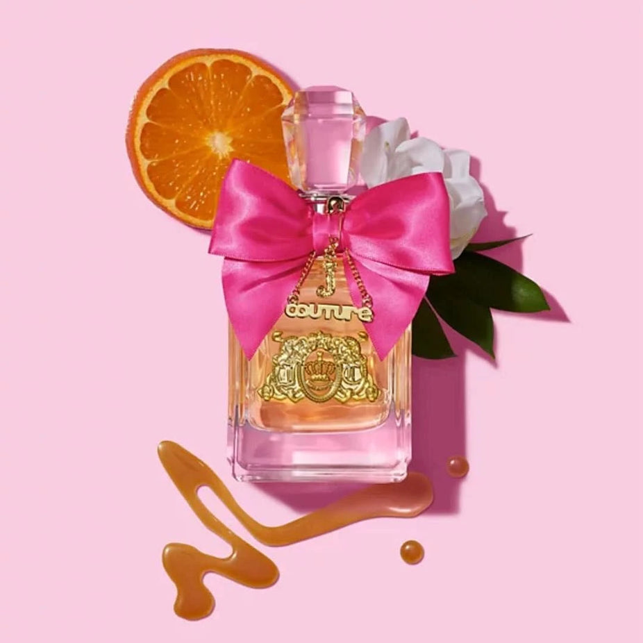 Viva La Juicy gift set with 1.7 oz and 0.33 oz Eau de Parfum bottles and 4.2 oz body souffle by Juicy Couture, displayed together.