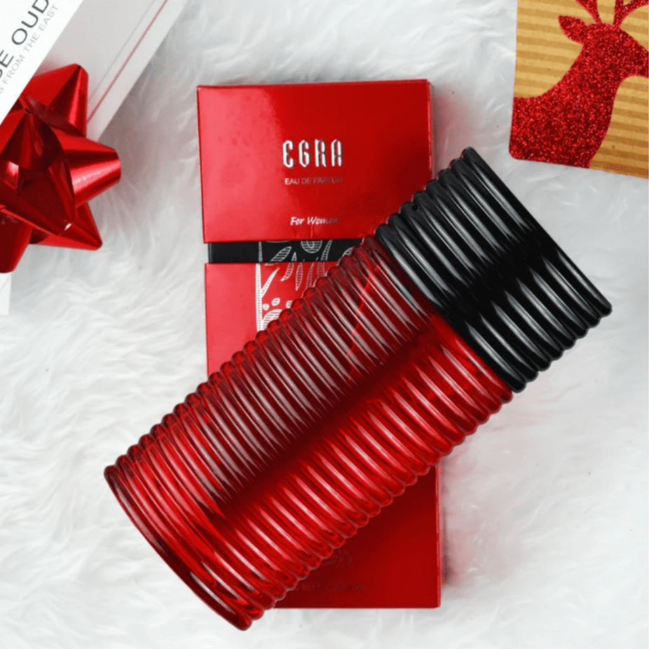 Egra EDP couple set by Rasasi, featuring 100ml bottles for men and women, displayed side by side in a sleek packaging design.