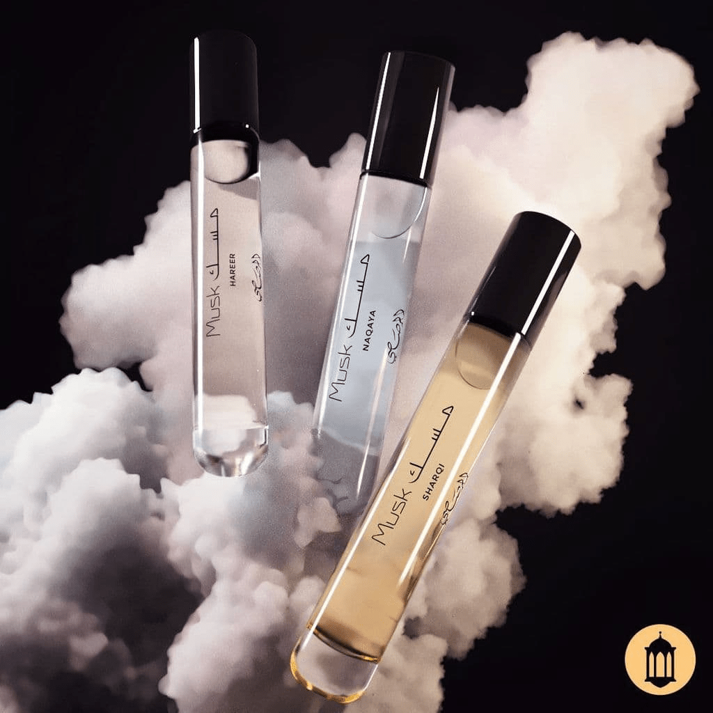 Set of three Rasasi Scent Odyssey Musk 7.5ML perfumes in velvet pouch, elegant gift set with aromatic fragrance bottles.