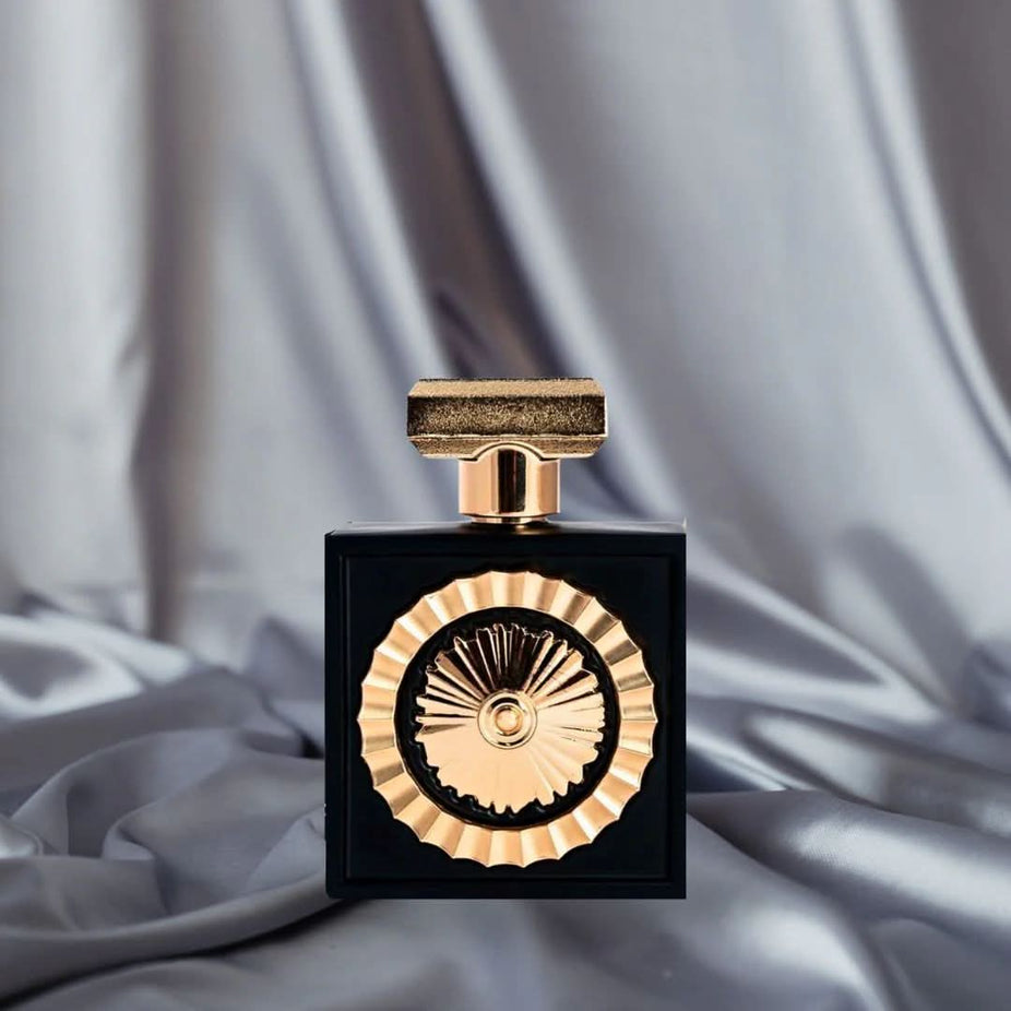 Bundle of Intense Oud Nebras Eau de Parfum spray and Yellow Musk water perfume by Hamidi, featuring elegant bottles on a neutral background.