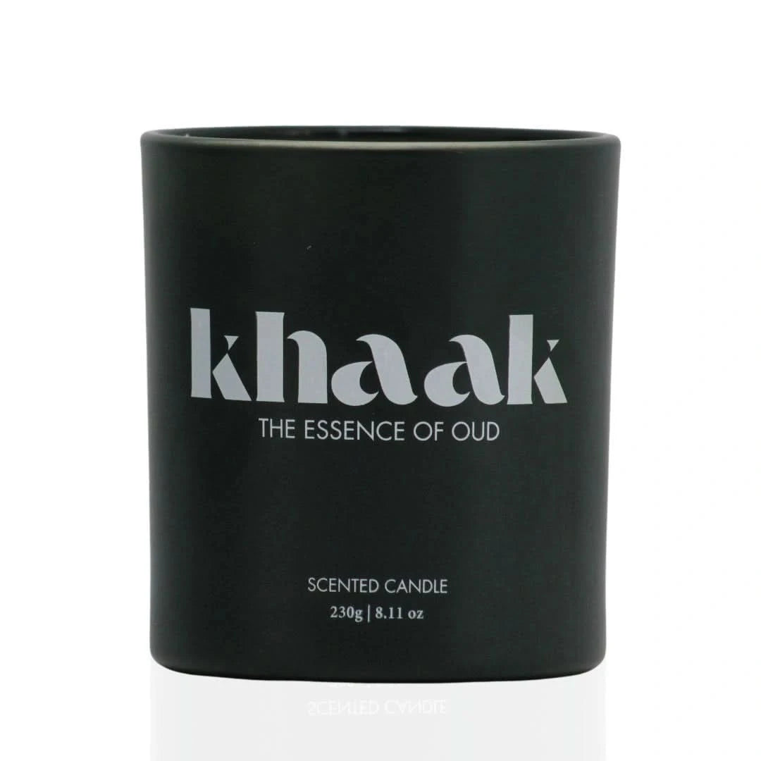 Intense Oud Khaak scented candle with driftwood, lily of the valley, Istanbul rose, white florals, and moss in a 230g wax jar.