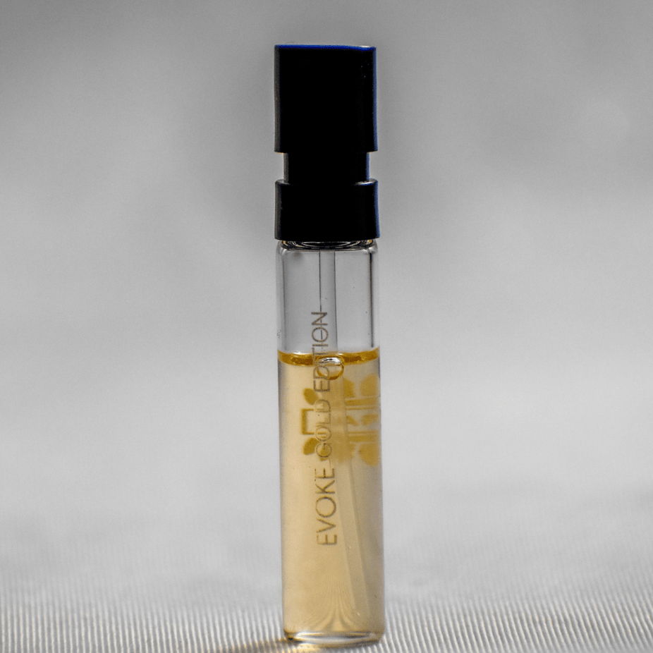 Evoke Gold Edition women's perfume sample by Ajmal, 1ML vial with gold branding, showcasing the perfume bottle and sample packaging.