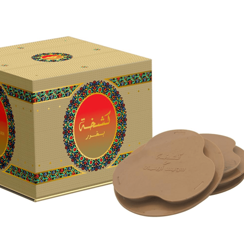 Swiss Arabian Bakhoor Kashkha tablets, traditional incense blocks with intricate packaging, used for home fragrance and aromatic burning.