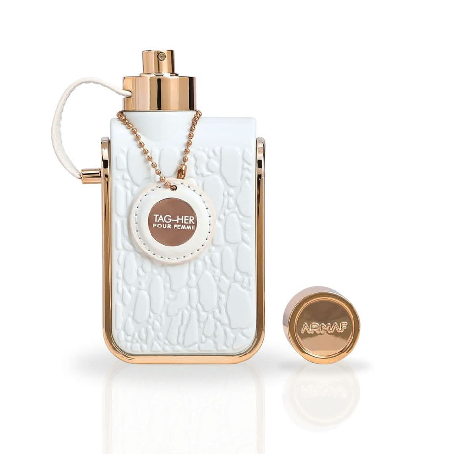 Armaf Tag Her Eau De Parfum spray 100ml bottle with elegant black and gold packaging, showcasing the fragrance's luxurious design.