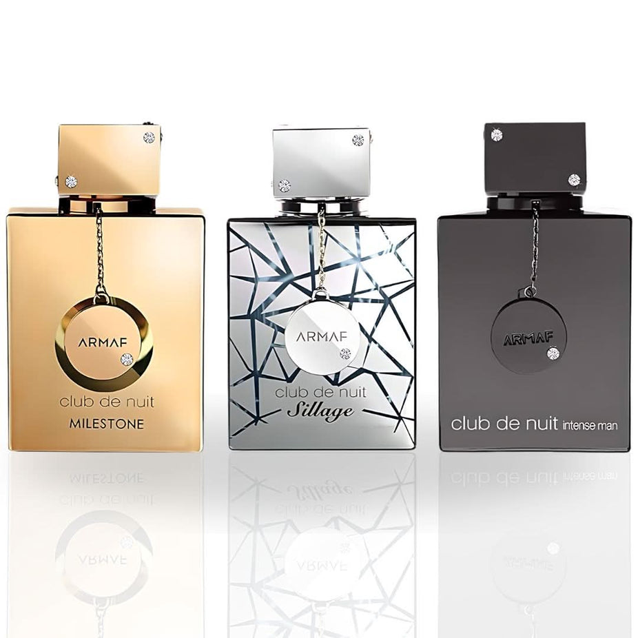 Three Armaf Club De Nuit Collector's Pride Eau de Parfum spray bottles in a gift set, featuring elegant 30ml (1 oz) containers.