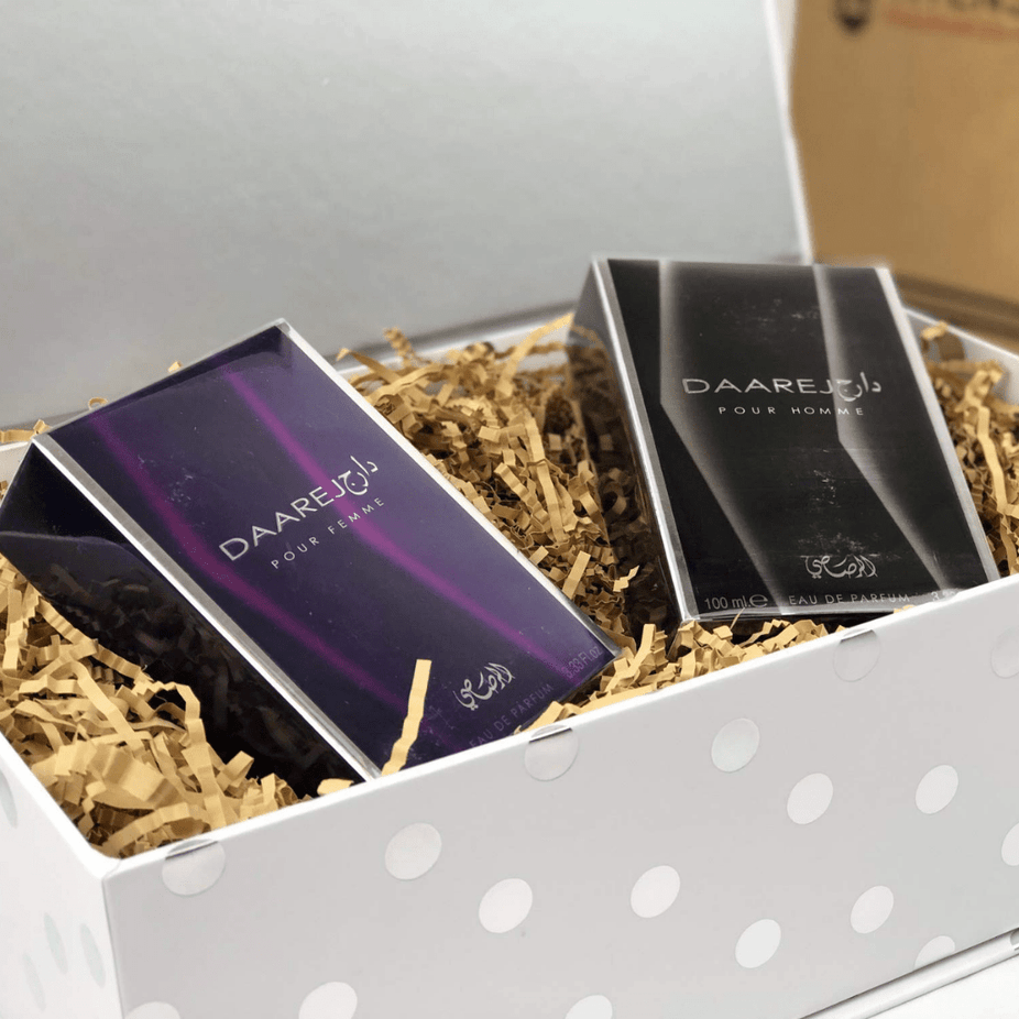 Daarej EDP couple set by Rasasi with two 100ml perfume bottles, one for men and one for women, displayed together.