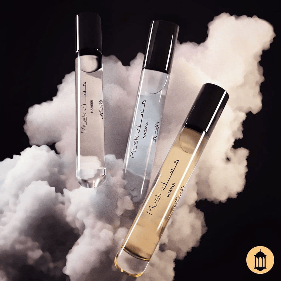 Set of three Rasasi Scent Odyssey Musk perfume bottles in 7.5ML gift set, showcasing elegant packaging and fragrance bottles.