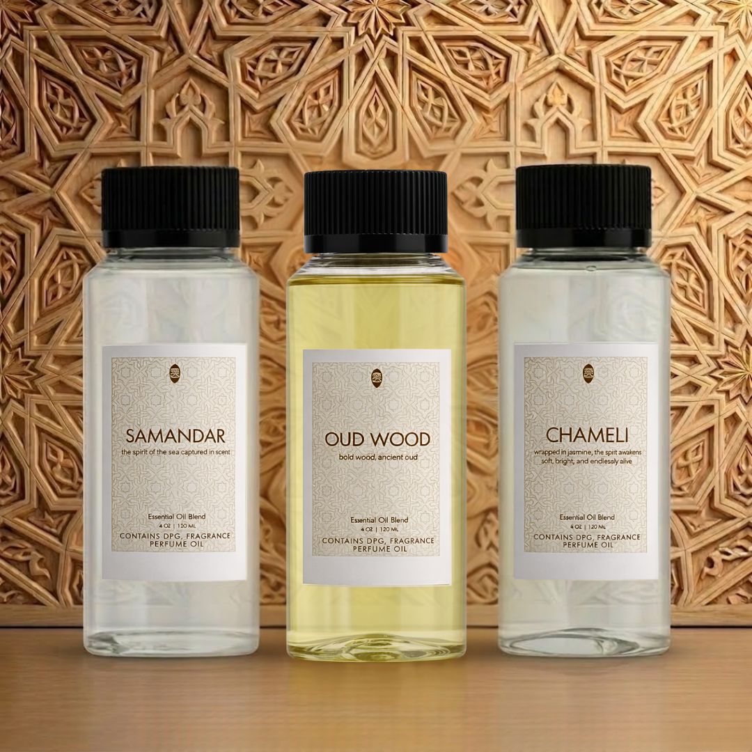 Intense Oud Classic concentrated perfume oil gift set with three elegant glass bottles and minimalist packaging.