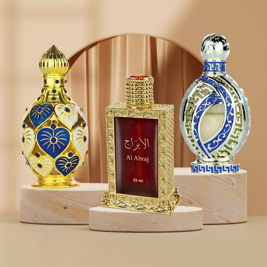Hamidi Al Abraj Jawahir Iqra perfume oils collection with elegant bottles and intricate packaging, showcasing luxury fragrance design.