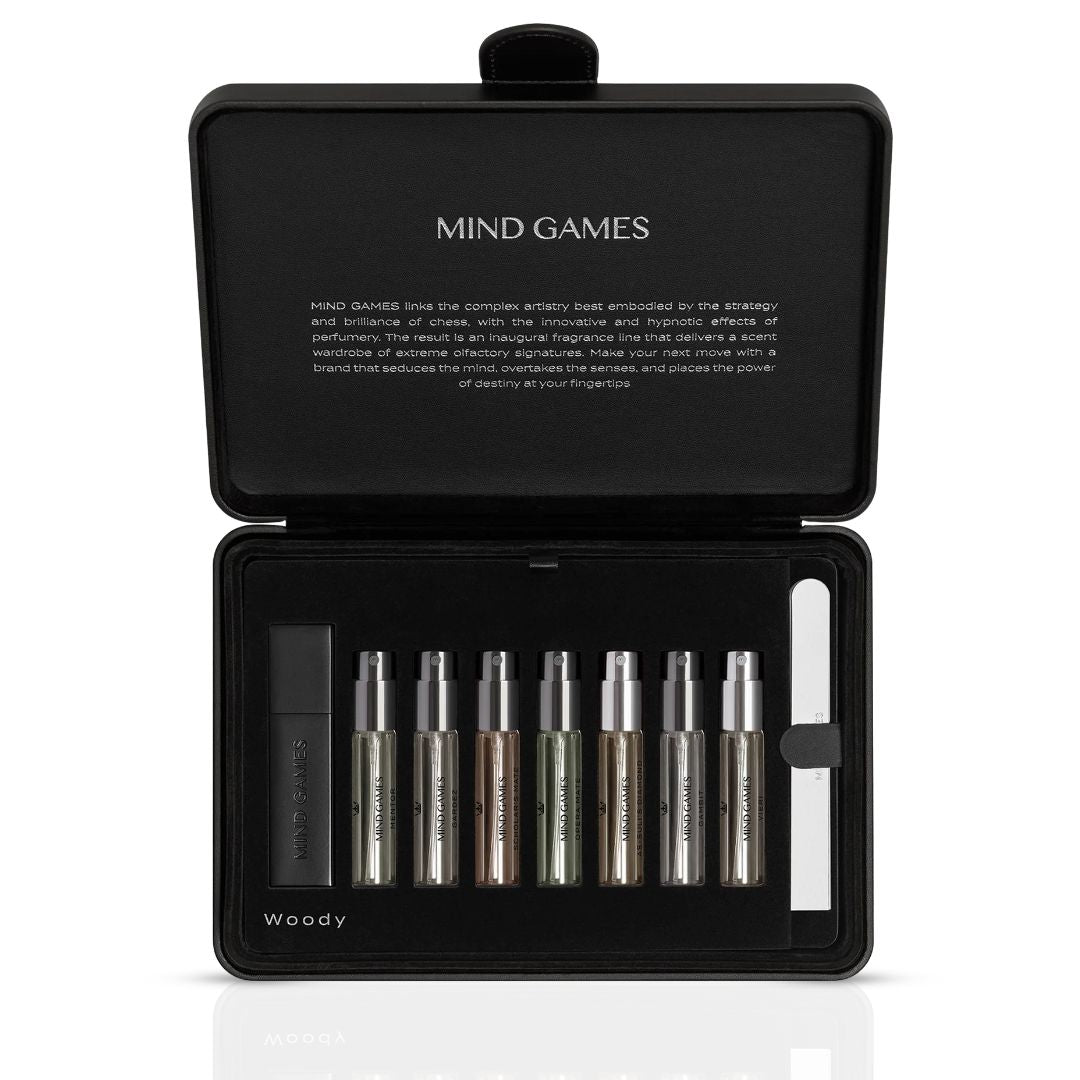 Olfactive Woody 7-piece discovery set by Mind Games, featuring seven 7.5ml fragrance vials in a collection.