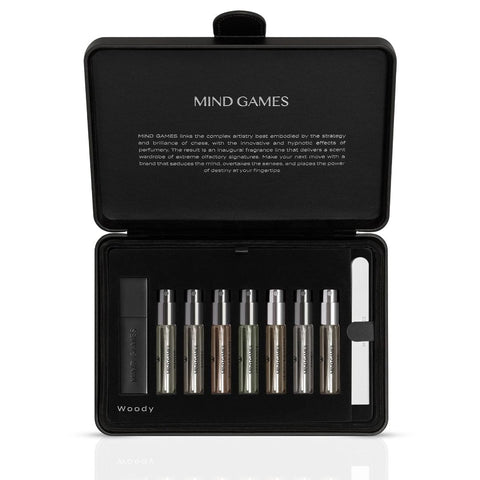 Olfactive Woody 7-piece discovery set by Mind Games, featuring seven 7.5ml fragrance vials in a collection.