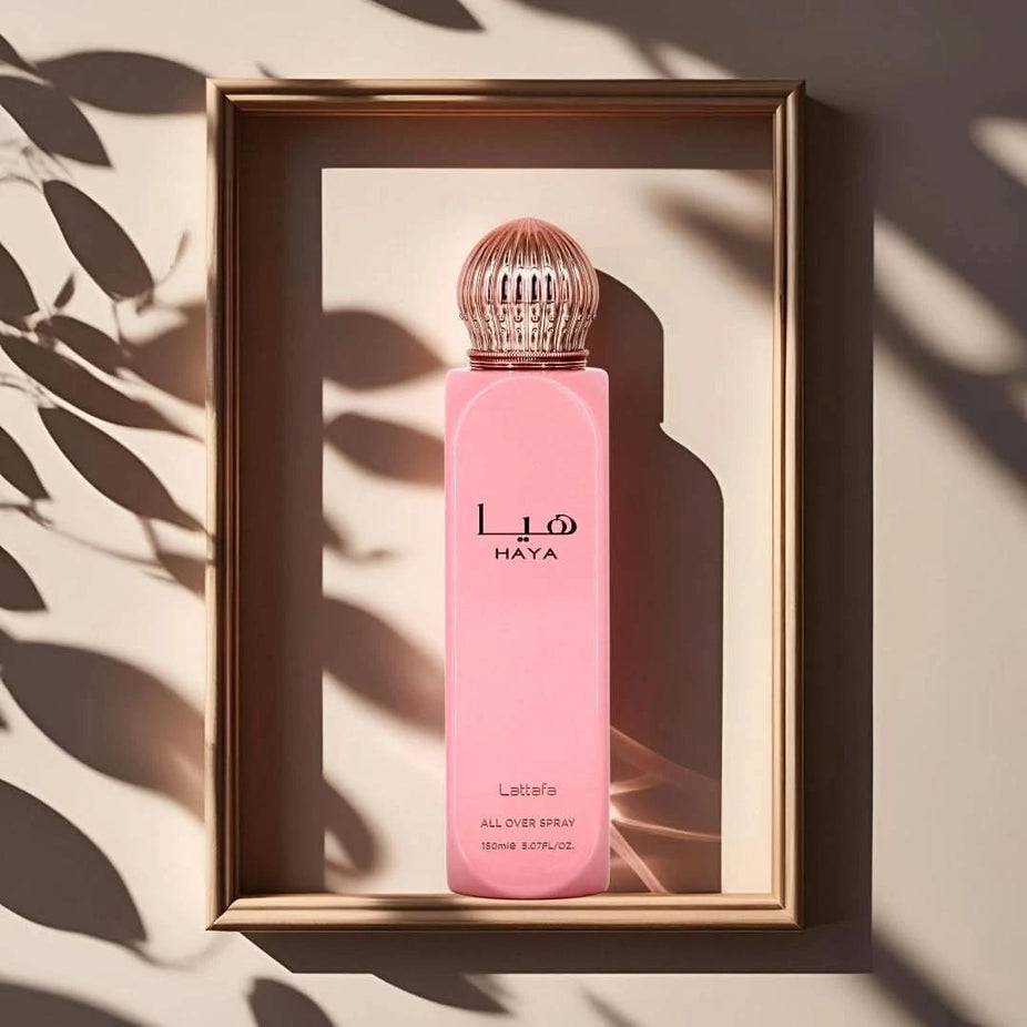 Lattafa Haya All Over Spray 150ml with floral and citrus notes, featuring a sleek bottle design and mist spray nozzle.