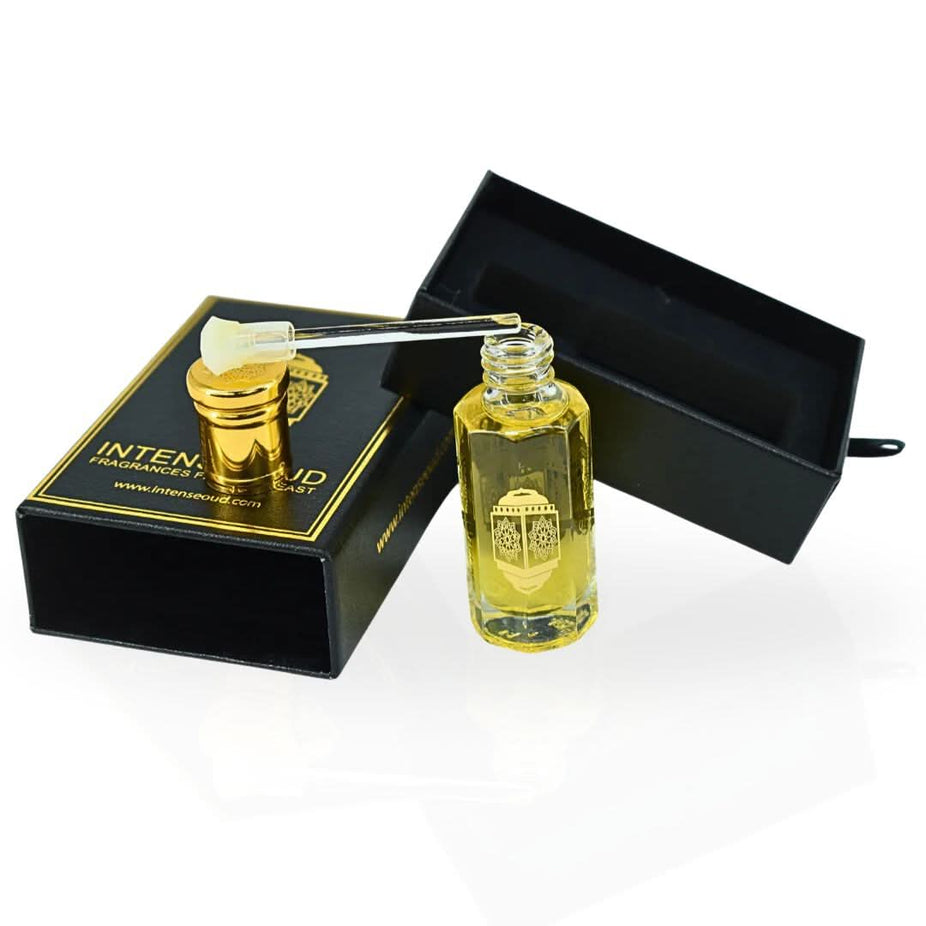 Intense Oud Bloom Perfume Oil 12ml in black gift box, featuring a sleek glass bottle with elegant branding and floral accents.