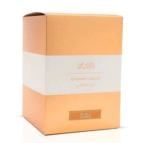Rasasi Qasamat Bareeq Oudh Moattar Bakhoor 50g in a decorative container with fragrant, resinous incense pieces.