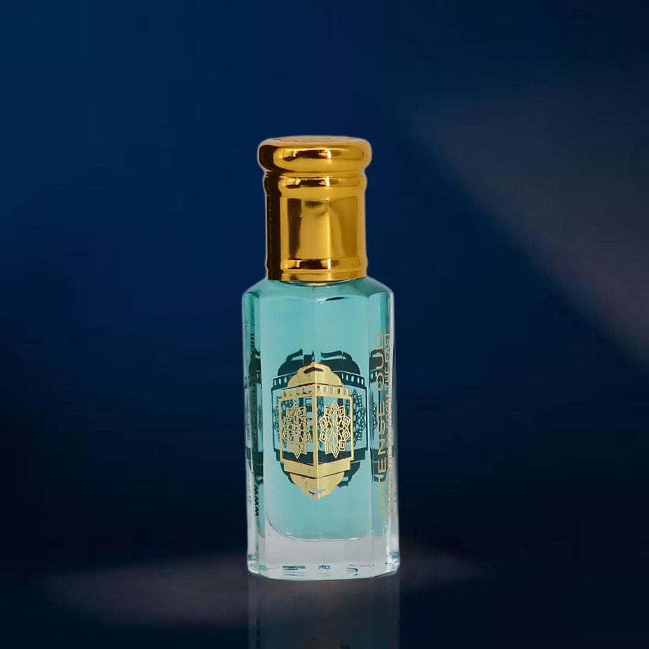 Intense Oud Crys Water Women Perfume Oil 12ml in a sleek black gift box, featuring a transparent bottle with fragrance oil.