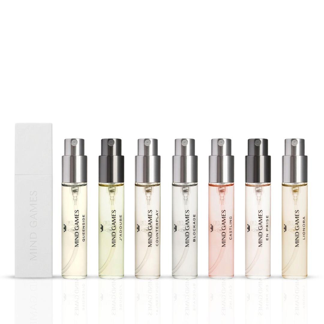 Mind Games Olfactive Fruity 7-piece discovery set with seven 7.5ml fragrance bottles, showcasing colorful packaging and variety.
