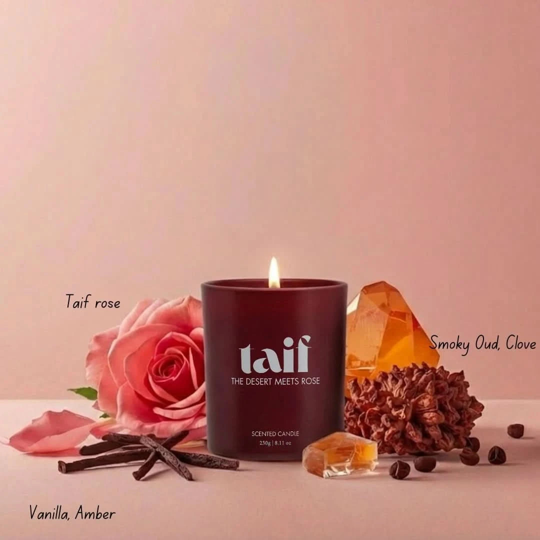 Intense Oud Taif Scented Candle in a glass jar with notes of Taif Rose, smoky Oud, clove, vanilla, and amber.