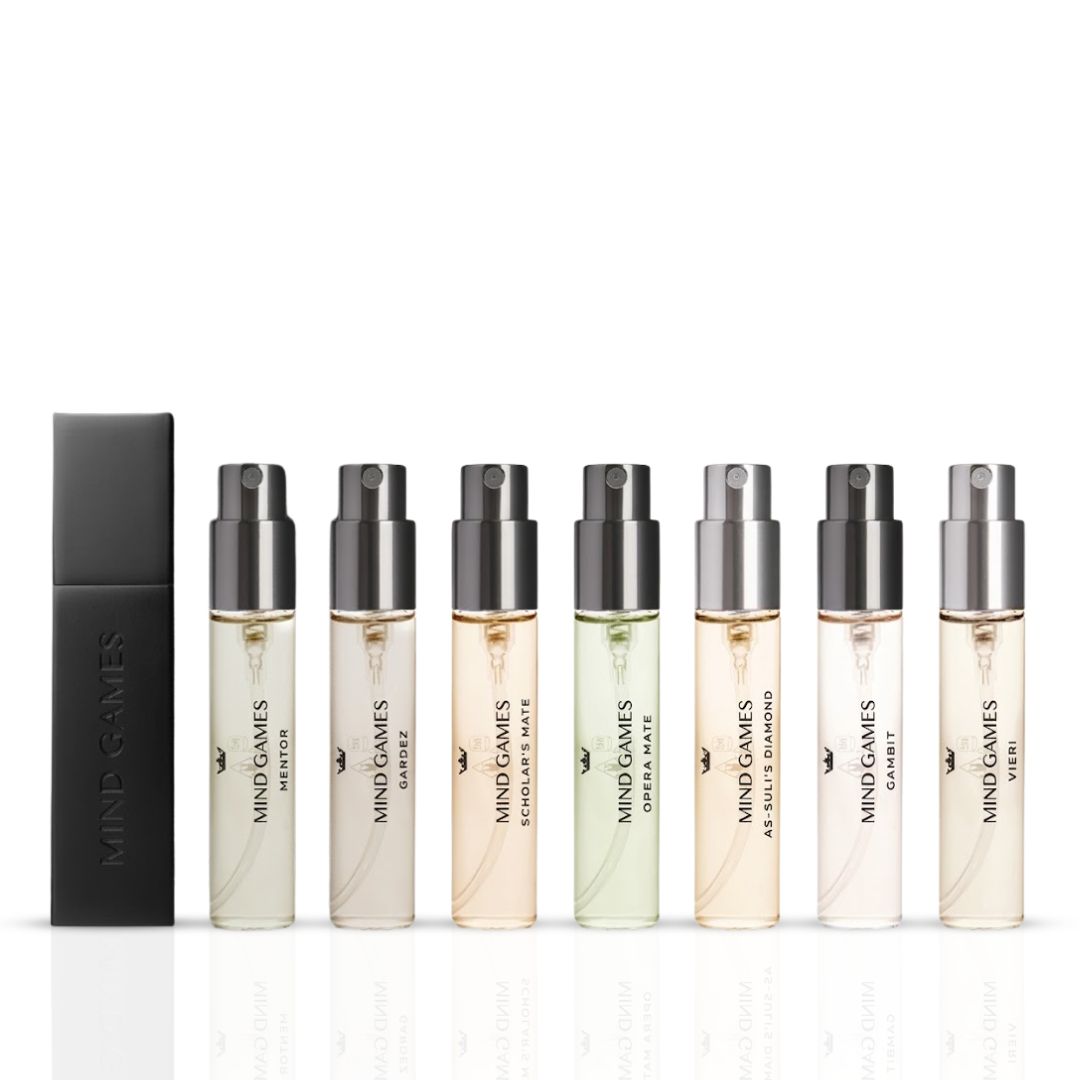Mind Games Olfactive Woody 7-piece discovery set featuring seven 7.5ml fragrance bottles in a collection.