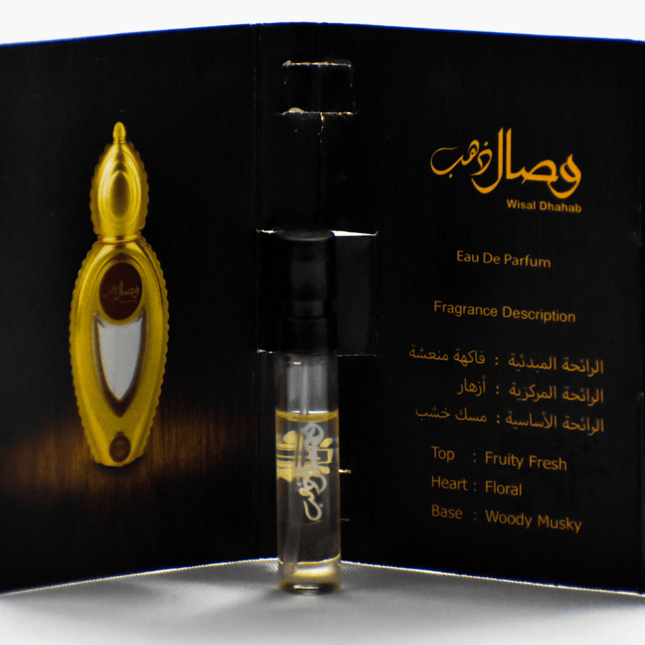 Ajmal Wisal Dhahab EDP sample bottle, 1ML unisex fragrance, clear container with silver cap, on a neutral background.