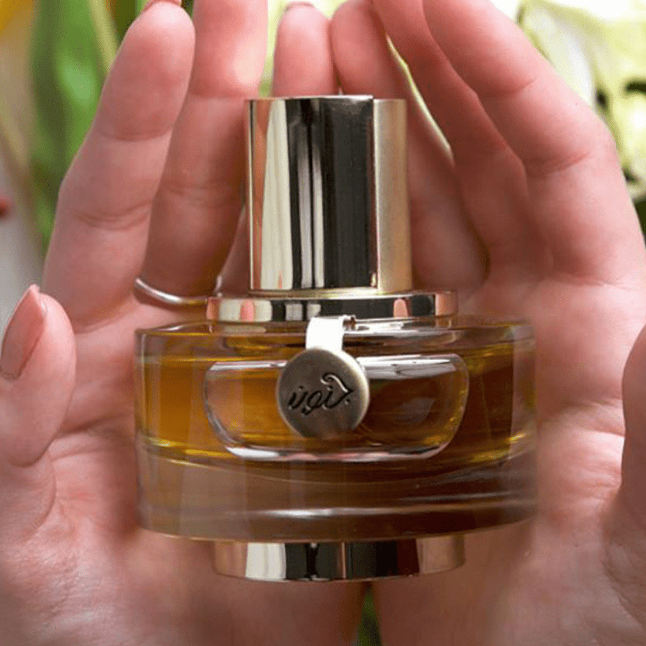 Rasasi Junoon Leather for Women Eau De Parfum 50ML bottle, elegant glass container with leather accents and floral design.