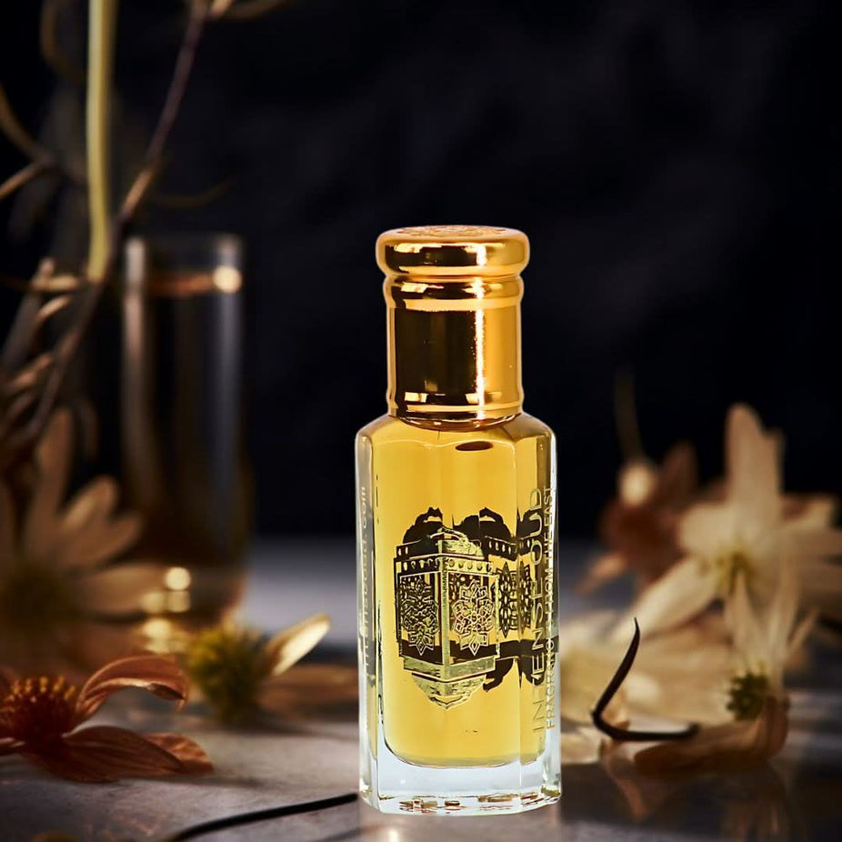 Lattafa Khamrah Dukhan Eau de Parfum 100ml and Red Tobaco Perfume Oil 12ml bundle, featuring luxurious fragrance bottles and packaging.