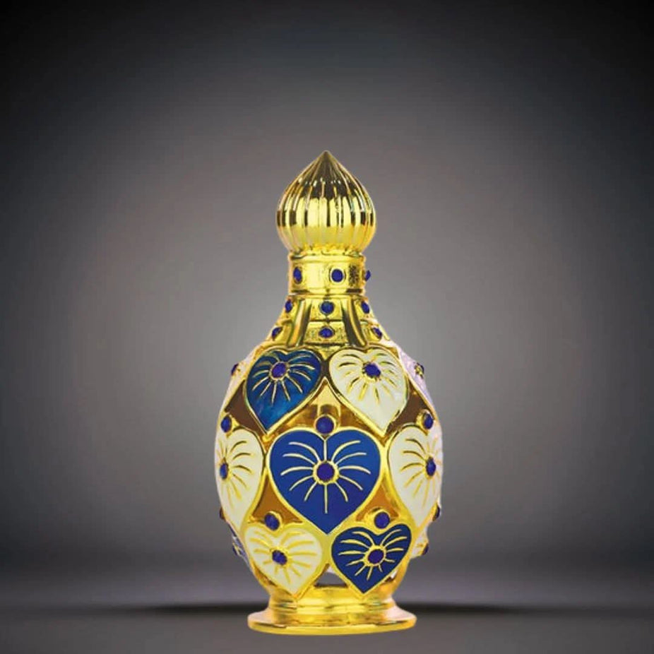 Hamidi Jawahir & Iqra perfume oils bundle showing four elegant glass bottles with intricate designs and gold accents.