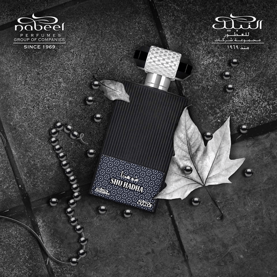 Shu Hadha Eau De Parfum by Nabeel Perfumes in a 100 ML bottle with a velvet pouch, showcasing the elegant fragrance packaging.