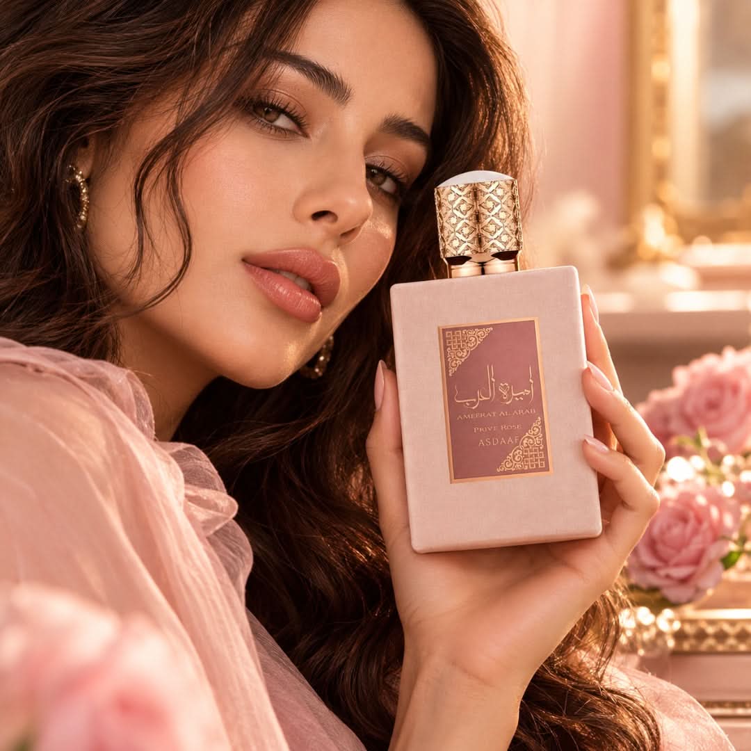 Ameerat Al Arab Prive Rose Eau De Parfum spray by Lattafa, 100ml, in a velvet pouch, featuring elegant floral perfume packaging.
