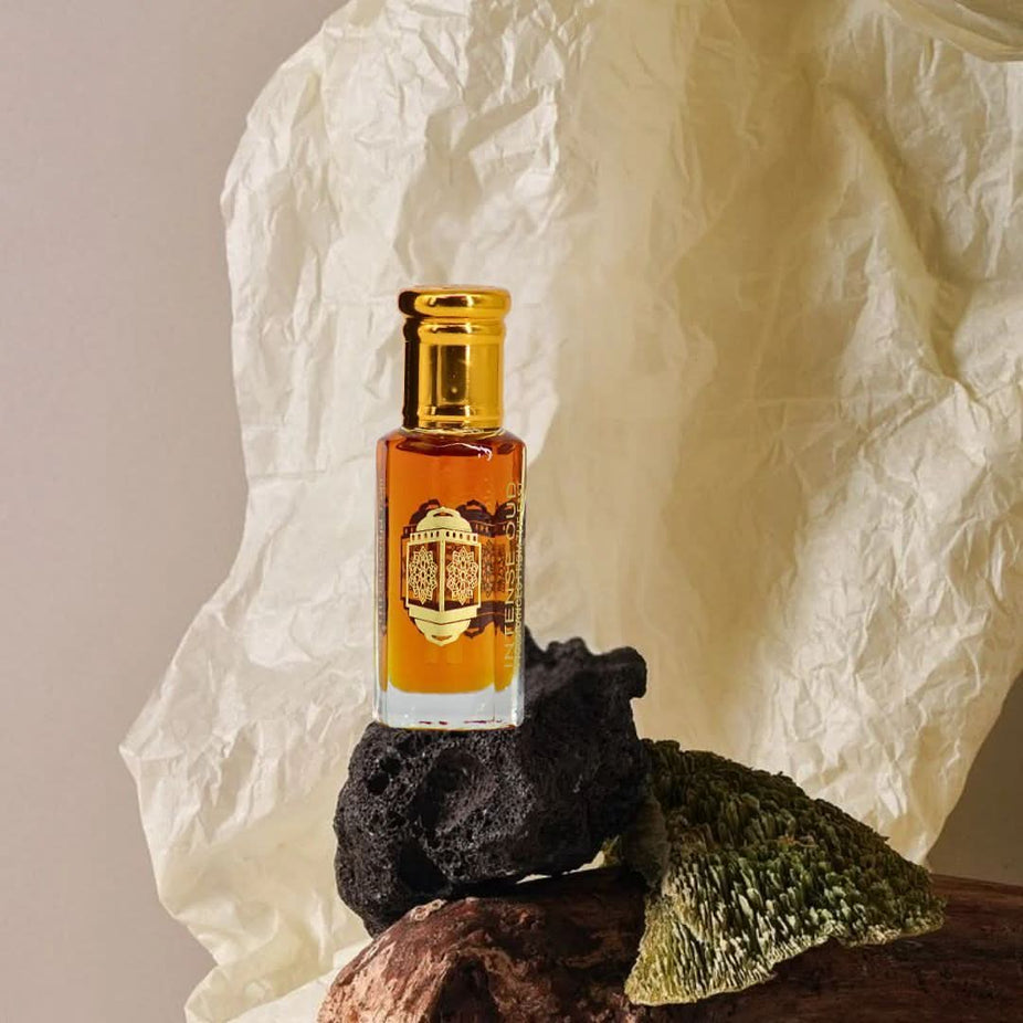 Set of Nouf and Dark Amber perfume oils by Intense Oud in 12ml bottles, presented in a sleek black gift box.