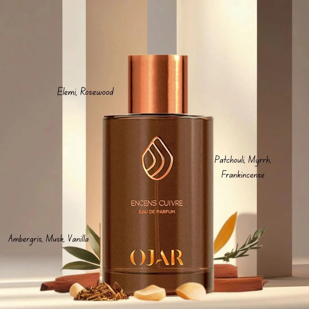 Ojar Encens Cuivre Eau De Parfum 100ml bottle with a sleek metallic cap and amber-colored liquid in a glass bottle.