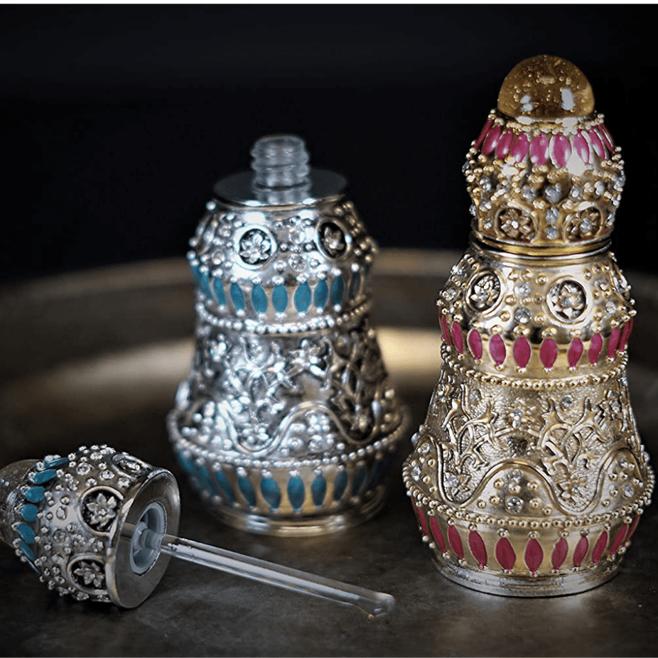 Insherah Gold Perfume Oil by Rasasi, 15ml CPO bottle with gold accents, showcasing elegant packaging and perfume oil inside.