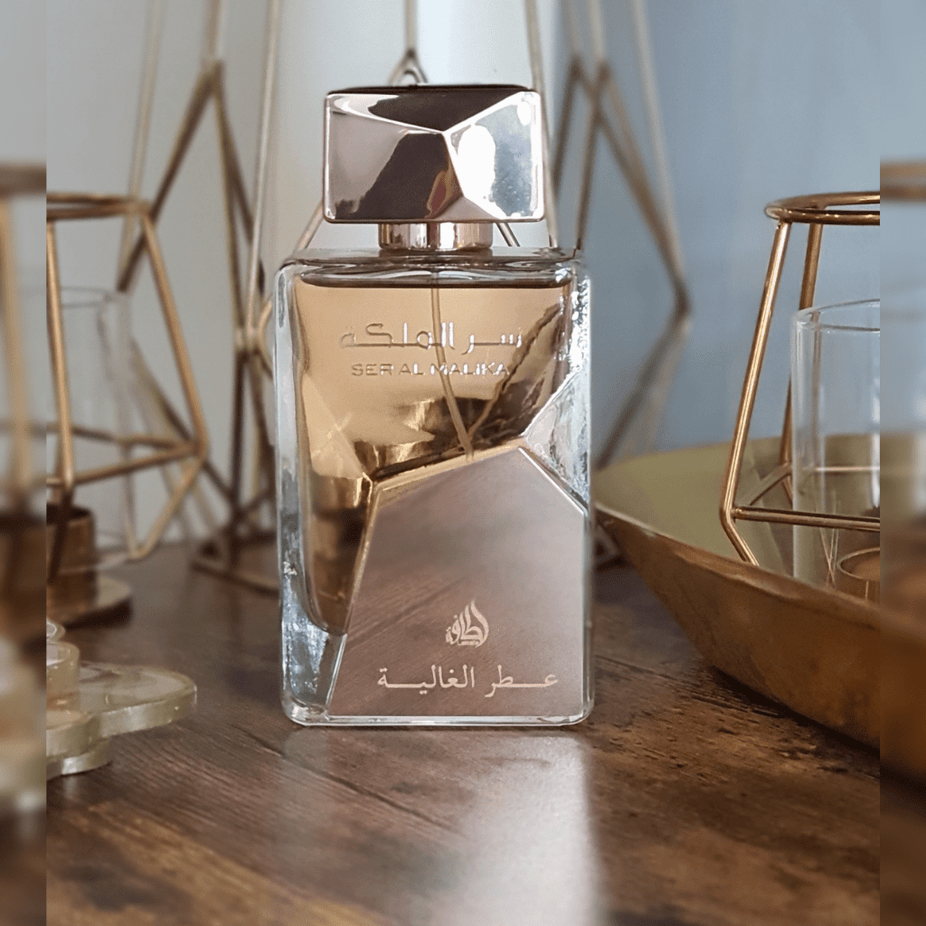 Lattafa Ser Al Malika Attar Al Ghalia EDP 100ML perfume bottle with intricate design, showcasing elegant packaging and floral accents.