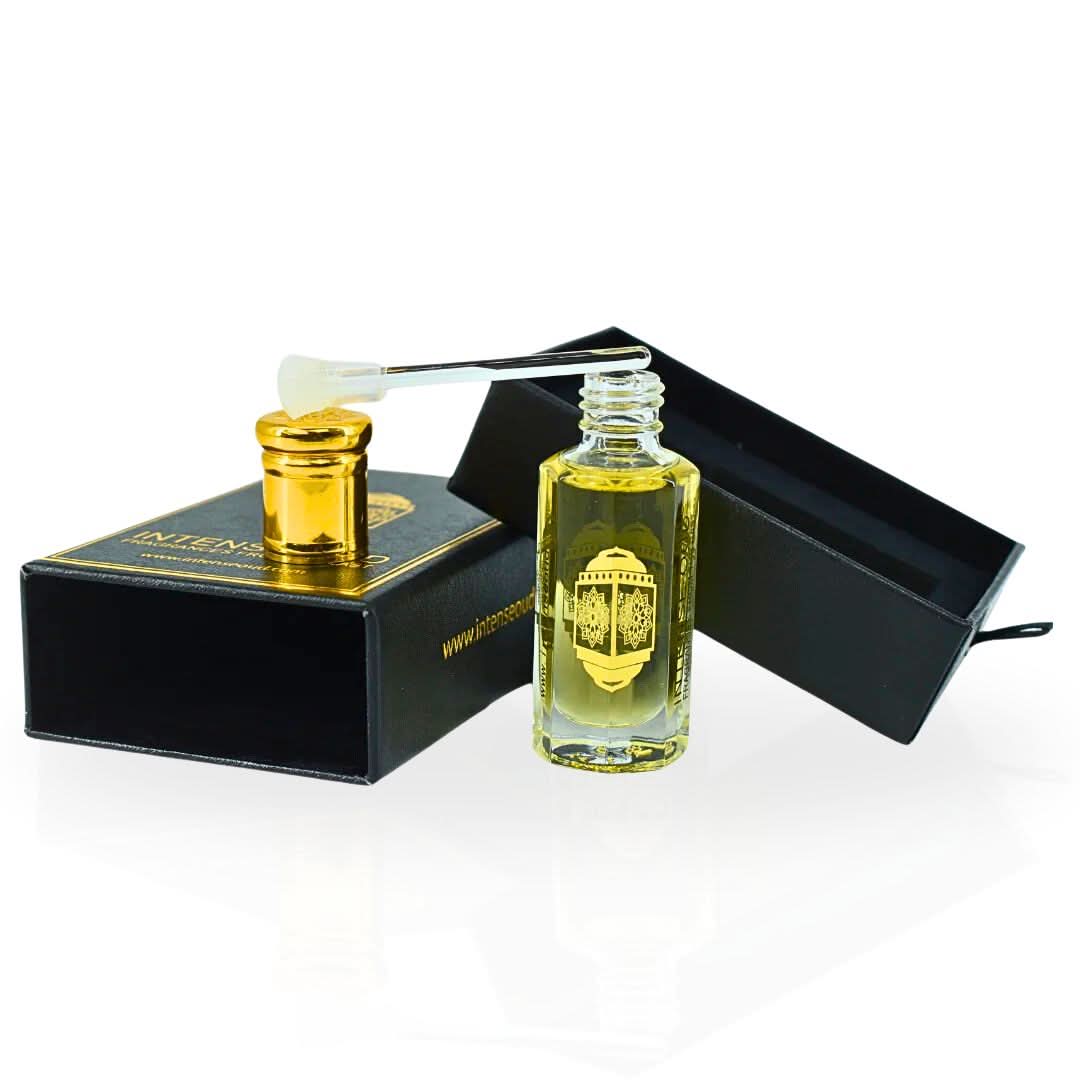 Intense Oud Scandalous perfume oil in a 12ml black gift box, featuring a luxurious loose oil bottle with elegant packaging.
