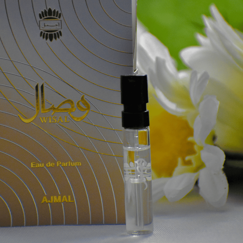 1ML Ajmal Wisal EDP sample for women, small clear vial with fragrance sample, featuring elegant design.