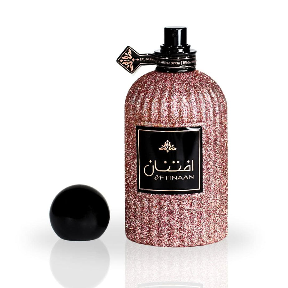 Eftinaan Eau de Parfum Spray by Ard Al Zaafaran, 100ml bottle with elegant packaging and cap, on a neutral background.