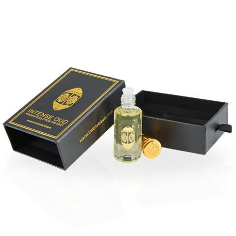 Intense Oud Attar Al Wardat perfume oil in 12ml bottle with black gift box, featuring a clear glass bottle and elegant packaging.